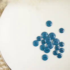 Bouton brillant polyester bleu pétrole