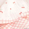 Double gaze de coton Bio réversible motif cerises rouges et carreaux fond blanc