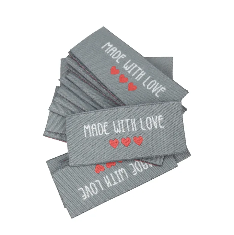 Etiquette tissée à coudre message "Made with Love" 20x45mm