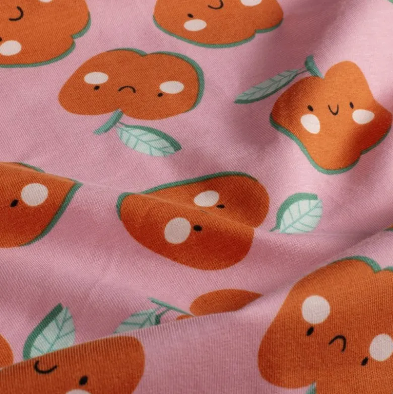 Jersey de coton motif pommes fond rose - OEKO TEX