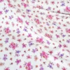 Jersey fleurs Léa fuchsia et parme fond blanc cassé – Poppy Fabrics - OEKO TEX
