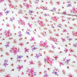 Jersey fleurs Léa fuchsia et parme fond blanc cassé – Poppy Fabrics - OEKO TEX