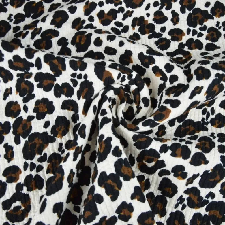 Seersucker surpiqué motif léopard sable et noir