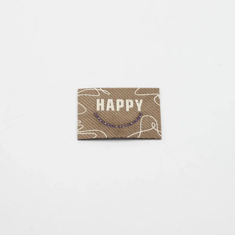 Étiquette tissée beige - Happy - strass doré
