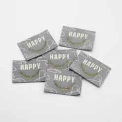 Étiquette tissée gris - Happy - strass doré