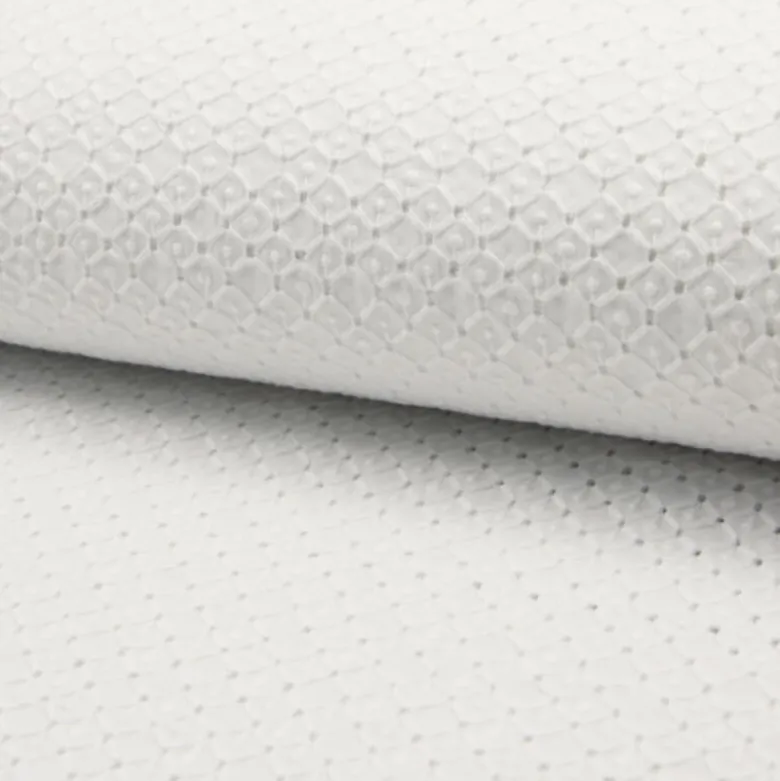 Tissu broderies anglaise Isaline coton blanc motifs nid d'abeille