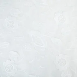 Tissu coton brodé blanc cassé à fleurs frangées
