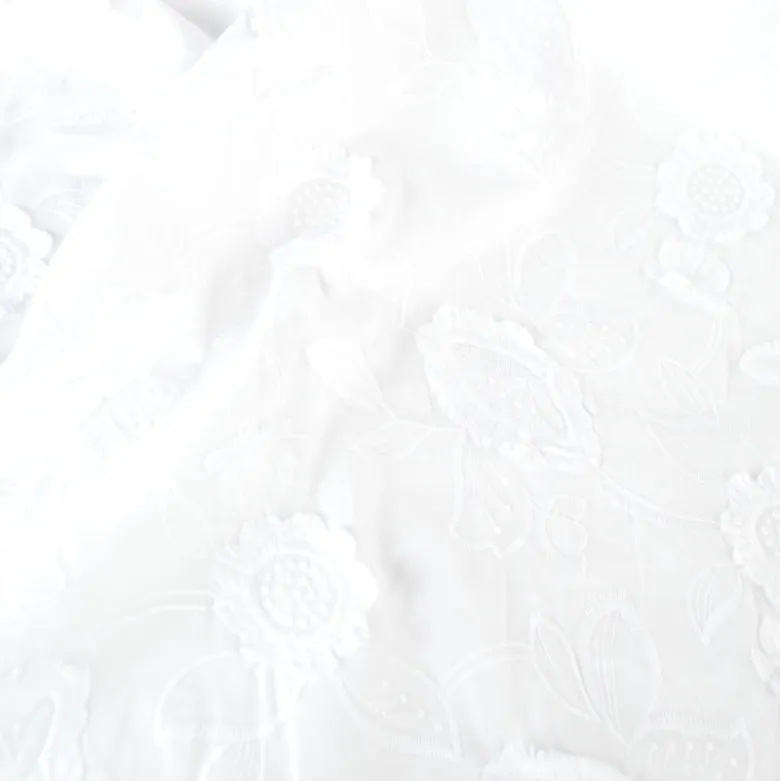 Tissu coton brodé blanc à fleurs frangées