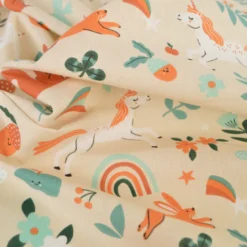 Tissu coton Cassiopée - Motif animaux et licornes fond Crème