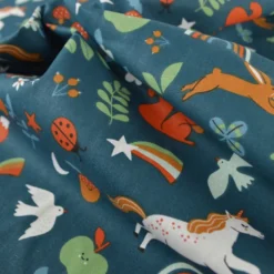 Tissu coton Cassiopée - Motif animaux et licornes fond pétrole