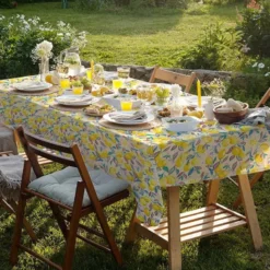 Tissu coton enduit citronnier fond blanc cassé