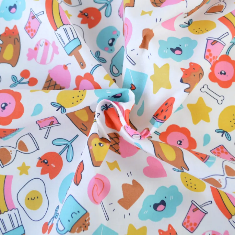 Tissu coton enduit Kawi motifs kawaii multicolores