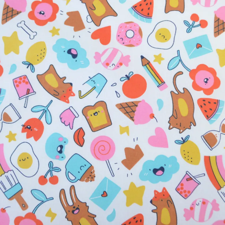 Tissu coton enduit Kawi motifs kawaii multicolores