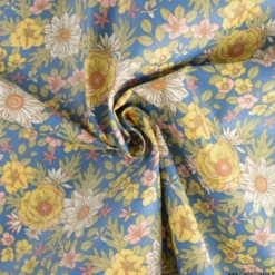 Tissu coton Enduit Lolita motifs fleurs fond marine