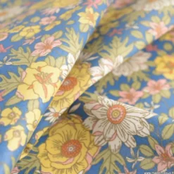 Tissu coton Enduit Lolita motifs fleurs fond marine