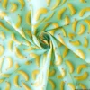 Tissu coton enduit motif bananes 3D – Fond vert menthe