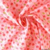 Tissu coton enduit motif cerises 3D – Fond rose pastel
