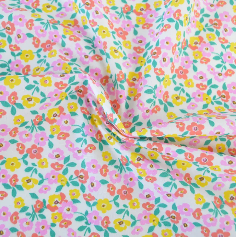 Tissu coton Enduit Thalie motif fleurs roses et jaunes