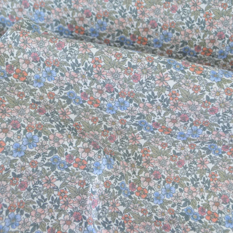 Tissu coton Natura motif petites fleurs vertes, corail et bleu