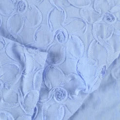 Tissu coton à ratyures Octave motif fleurs en relief