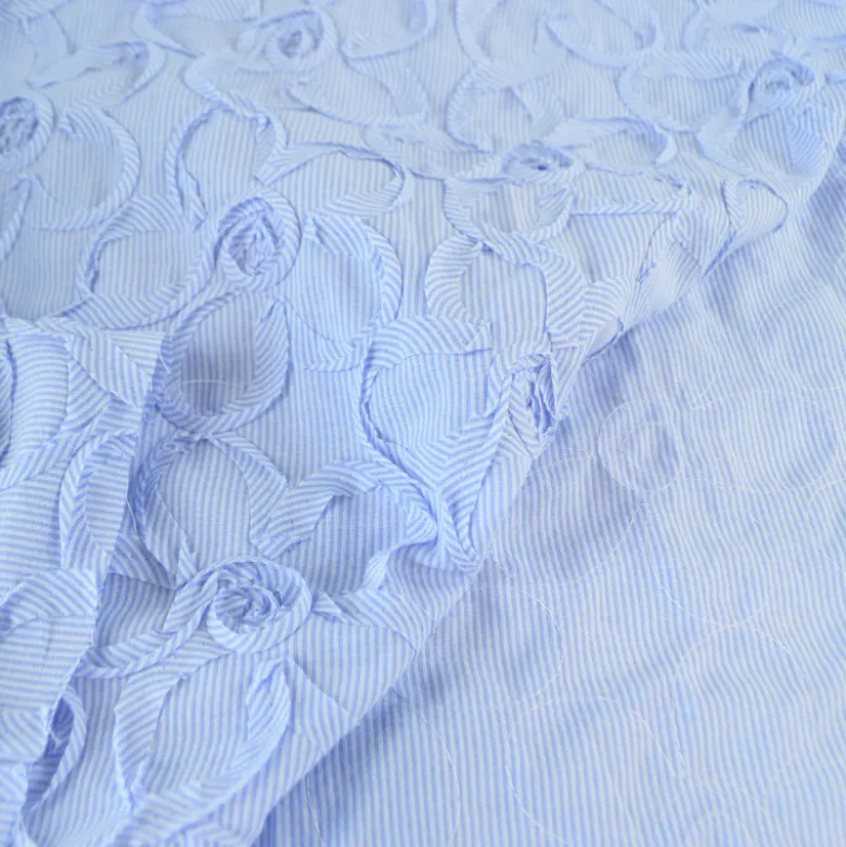 Tissu coton à ratyures Octave motif fleurs en relief