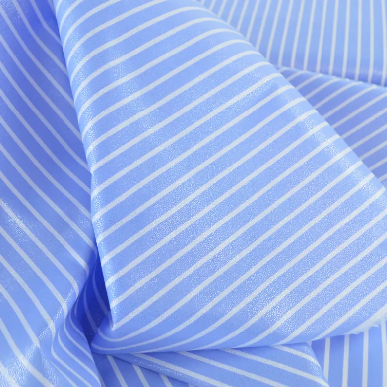 Tissu coton à rayures larges irisées bleus et blanches