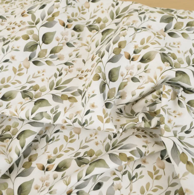 Tissu cretonne coton Luara feuillage vert fond blanc