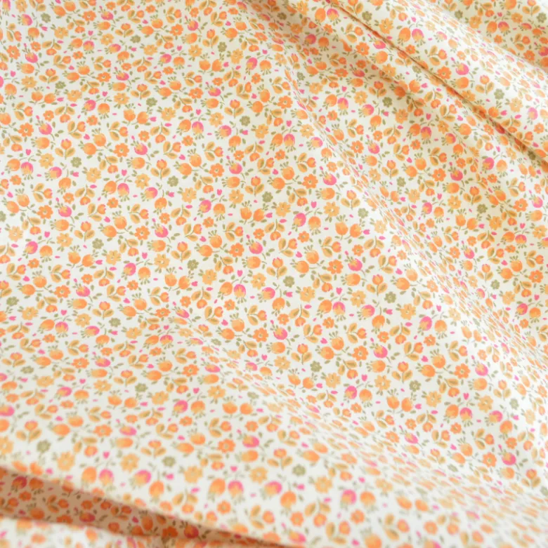 Tissu Cretonne de Coton Caseille motif fleurs roses et oranges