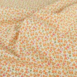 Tissu Cretonne de Coton Caseille motif fleurs roses et oranges