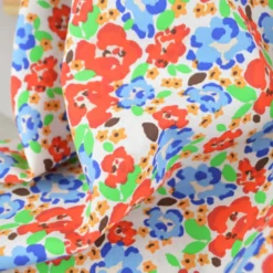 Tissu Cretonne de Coton Odalie motif fleurs rouges et bleues