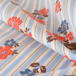 Tissu demi-natté coton Rimcha, rayures bleues et fleurs rouges/bleues