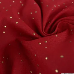 Tissu demi natté de Noël Pimiz motif pois dorés fond Cardinal- OEKO TEX