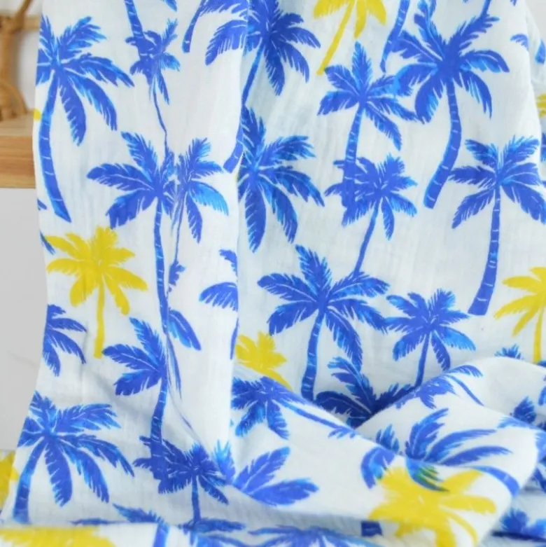 Tissu Double gaze coton motif palmiers bleus et jaunes - OEKO TEX