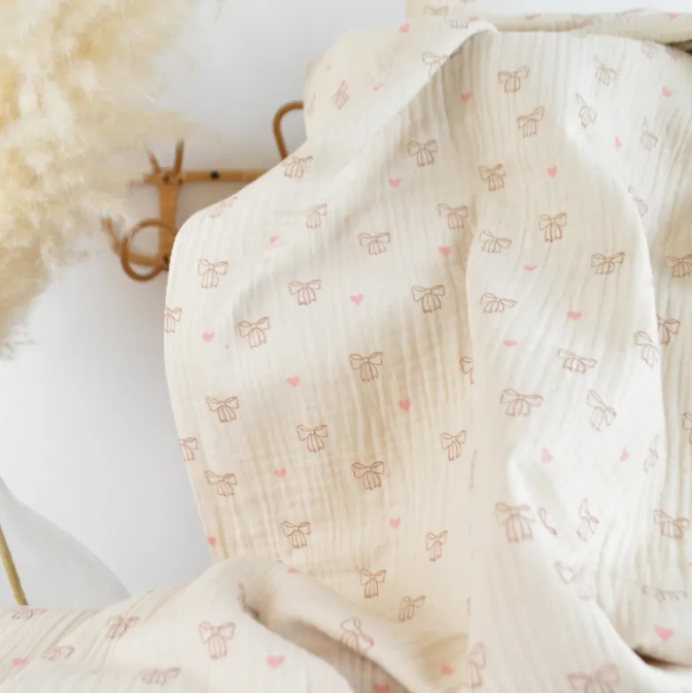 Tissu double gaze de coton Bio Poppy motif nœuds fond naturel