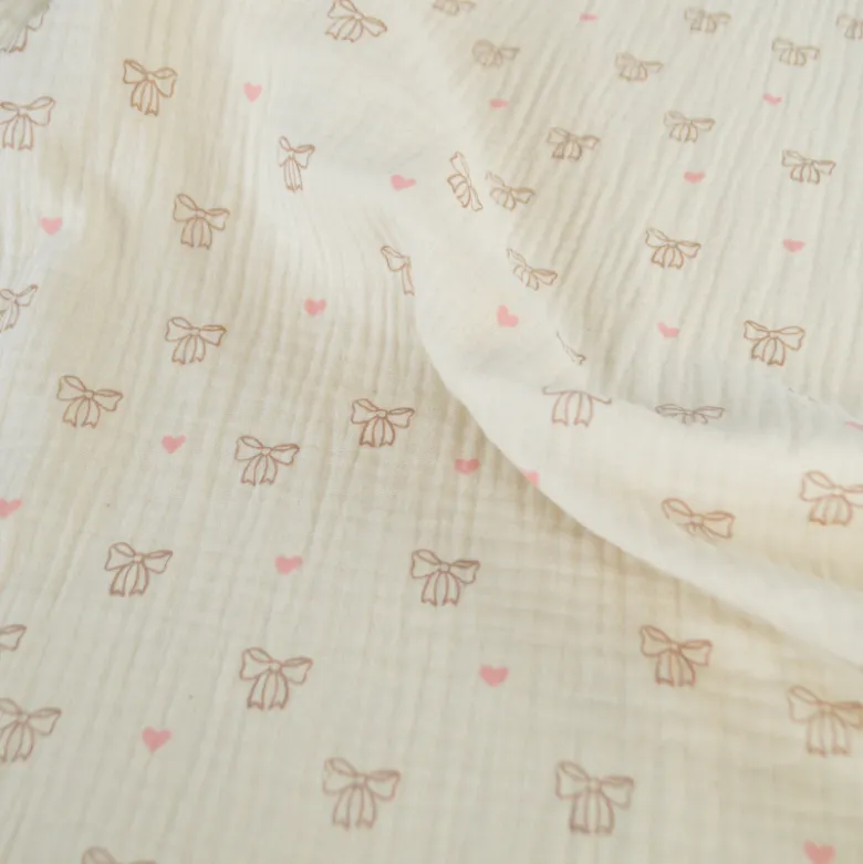 Tissu double gaze de coton Bio Poppy motif nœuds fond naturel