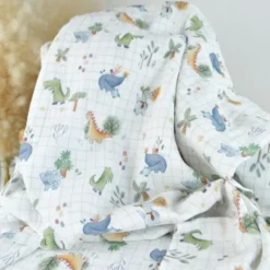 Tissu double gaze de coton Ceradino motif dinosaures fond à carreaux blanc