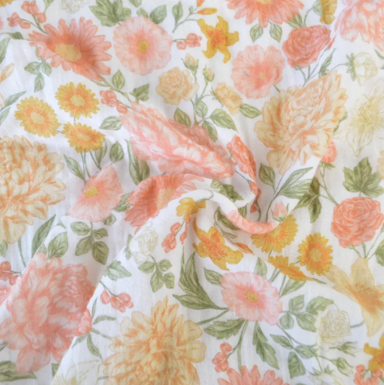 Tissu double gaze de coton Elisabeth motif fleurs tons roses et Abricot