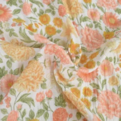 Tissu double gaze de coton Elisabeth motif fleurs tons roses et Abricot