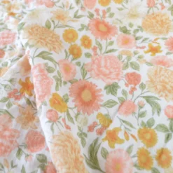 Tissu double gaze de coton Elisabeth motif fleurs tons roses et Abricot