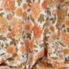 Tissu double gaze de coton Elisabeth motif fleurs tons orangés et rose