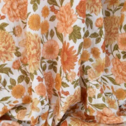 Tissu double gaze de coton Elisabeth motif fleurs tons orangés et rose