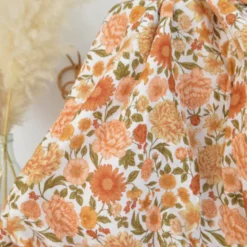 Tissu double gaze de coton Elisabeth motif fleurs tons orangés et rose