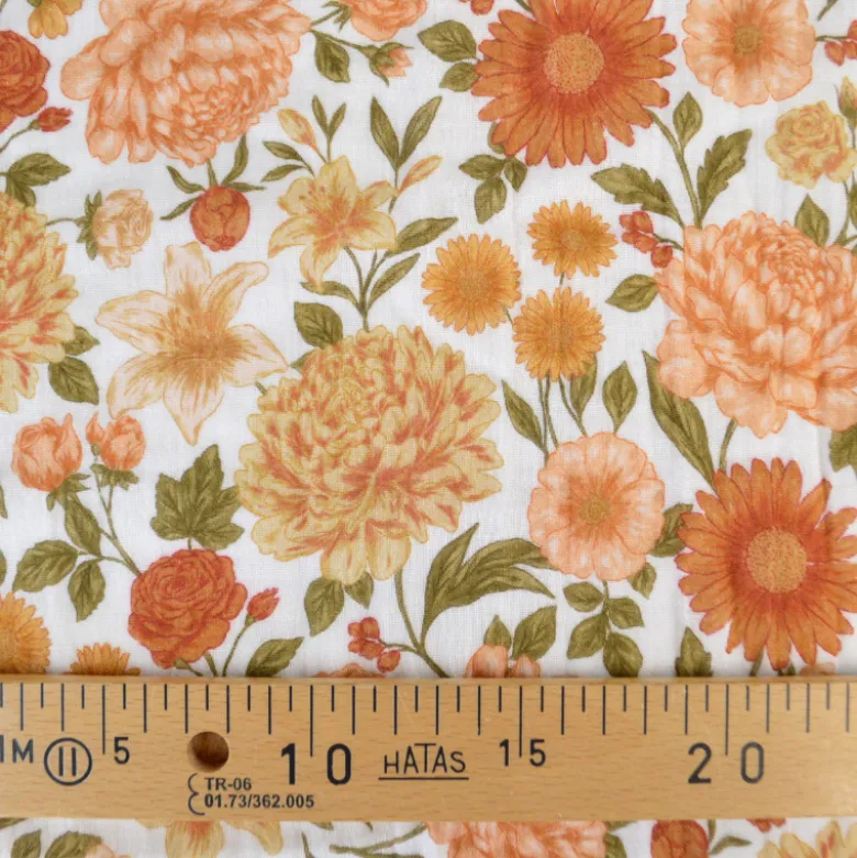 Tissu double gaze de coton Elisabeth motif fleurs tons orangés et rose