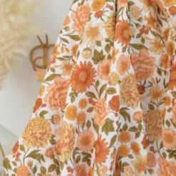 Tissu double gaze de coton Elisabeth motif fleurs tons orangés et rose
