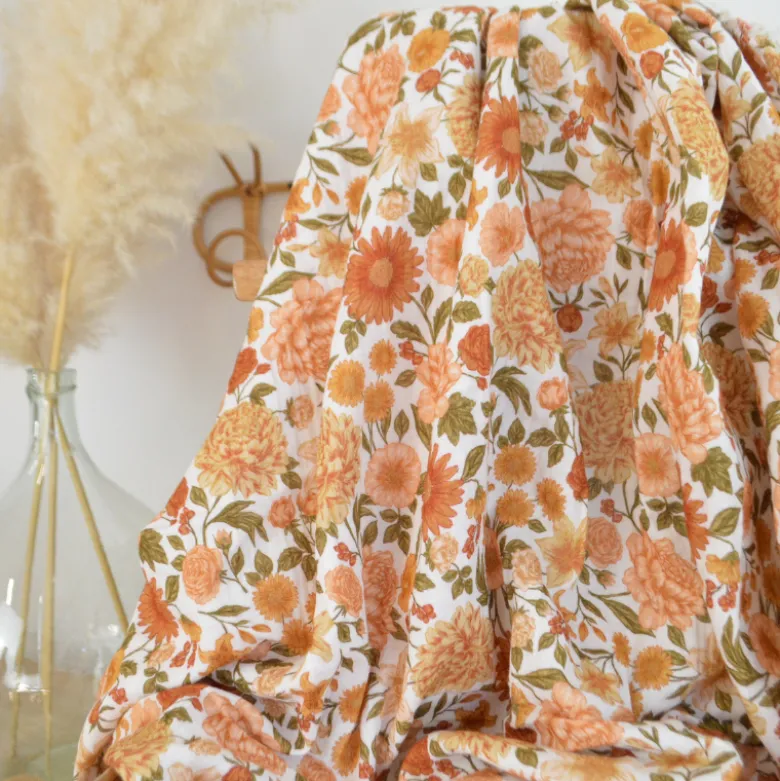 Tissu double gaze de coton Elisabeth motif fleurs tons orangés et rose