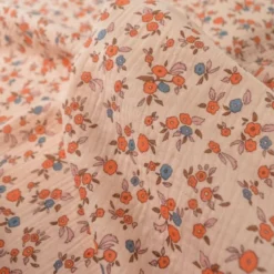 Tissu double gaze de coton June fleurs fond rose skin