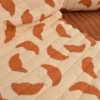 Tissu double gaze de coton matelassé croissants nude envers toffee
