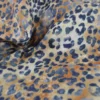 Tissu double gaze motif léopard Sable et bleu marine