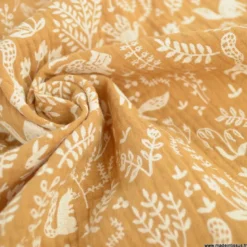 Tissu Double gaze Tolly motif animaux et feuillage fond Camel - OEKO TEX