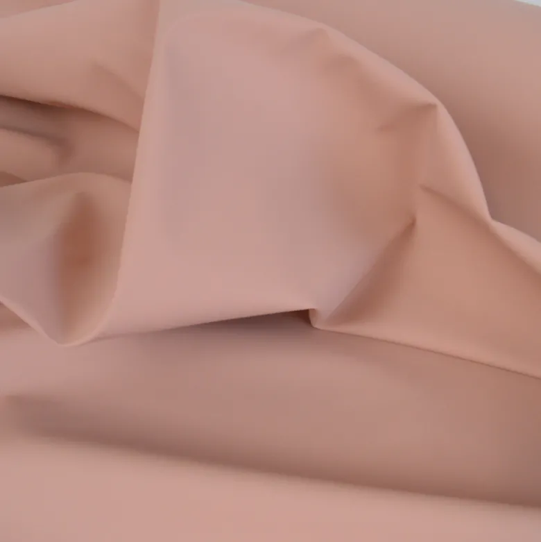 Tissu enduit ciré de pluie uni coloris Saumon